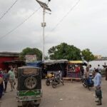 Street activity with people and vehicles at Rupsha Ghat, Khulna