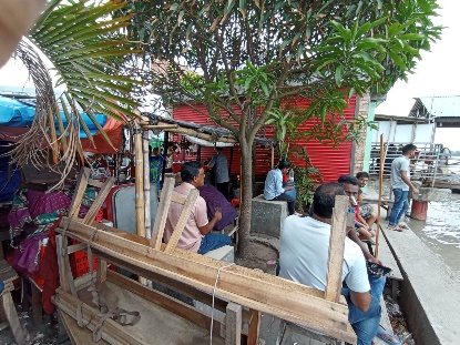 Informal riverside stall and seating at Rupsha Ghat